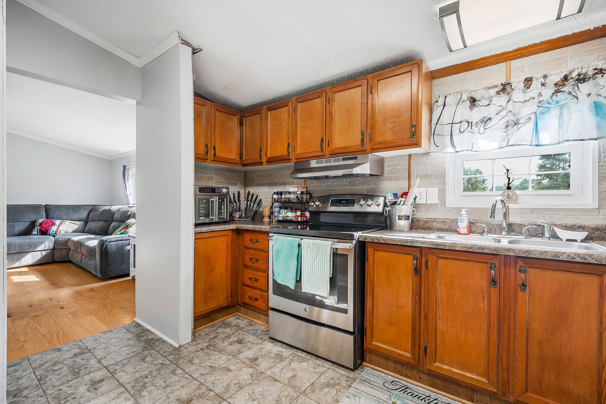 227 B A R Road Baxter, TN 38544 - Photo 8 of 52 a kitchen with stainless steel appliances granite countertop a stove a sink and a refrigerator