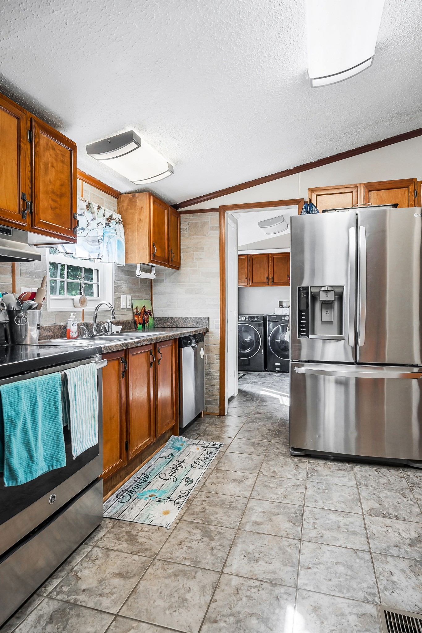 227 B A R Road Baxter, TN 38544 - Photo 10 of 52 a kitchen with stainless steel appliances granite countertop a stove a sink and a refrigerator