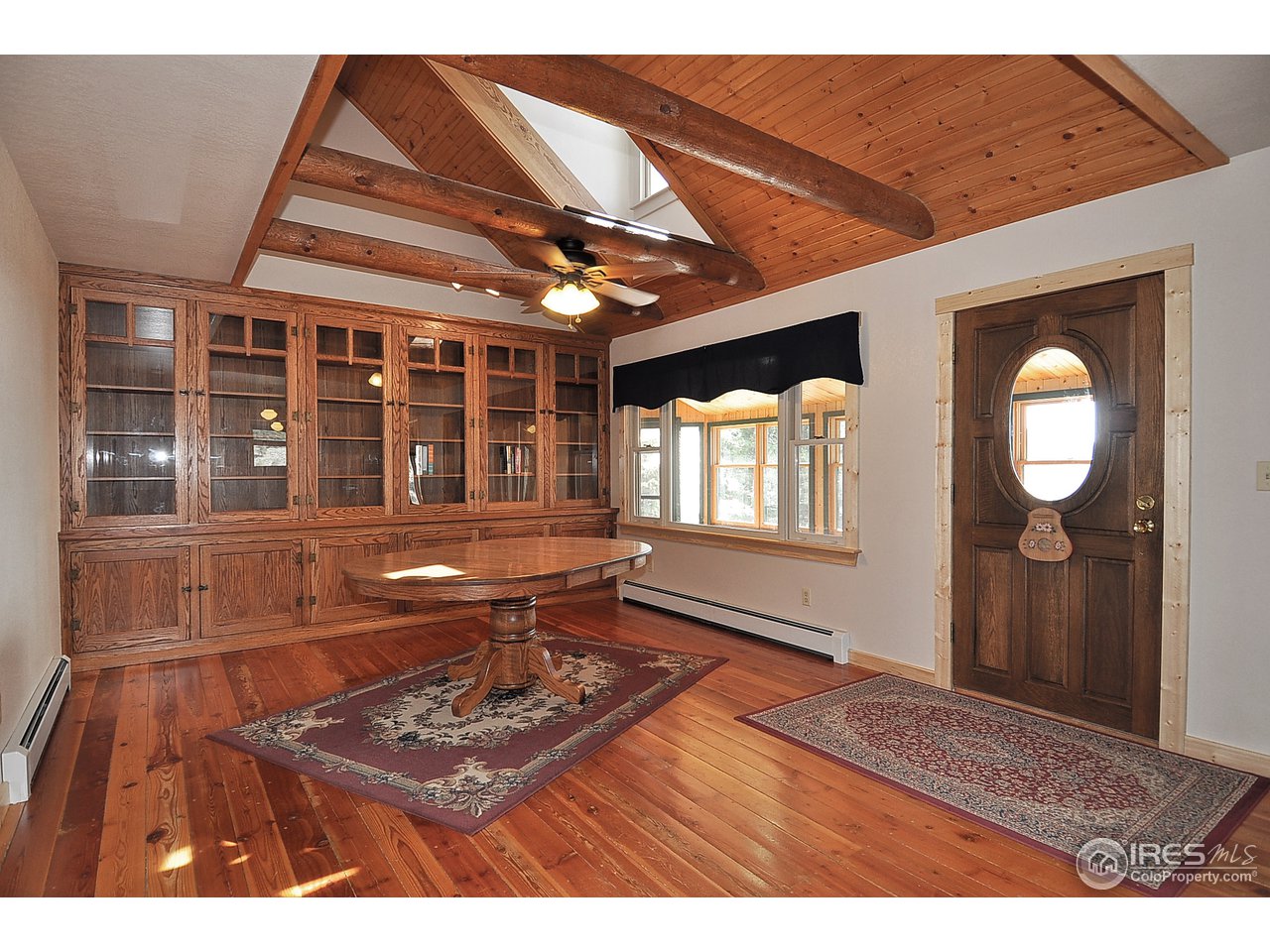 439 Redtail Ridge Way Bellvue, CO 80512 - Photo 6 of 25 a view of a livingroom with wooden floor and furniture
