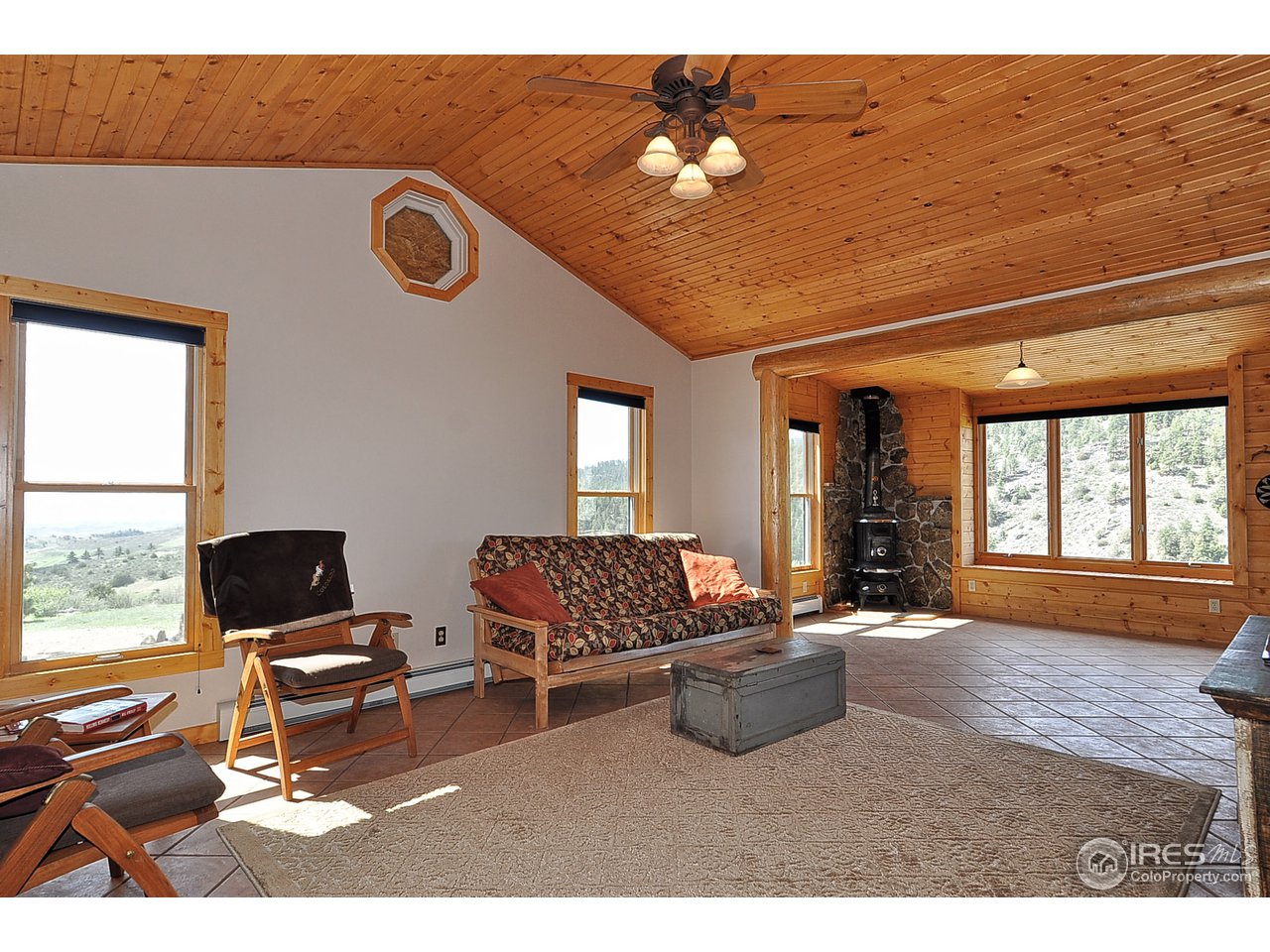 439 Redtail Ridge Way Bellvue, CO 80512 - Photo 8 of 25 a living room with furniture and wooden floor