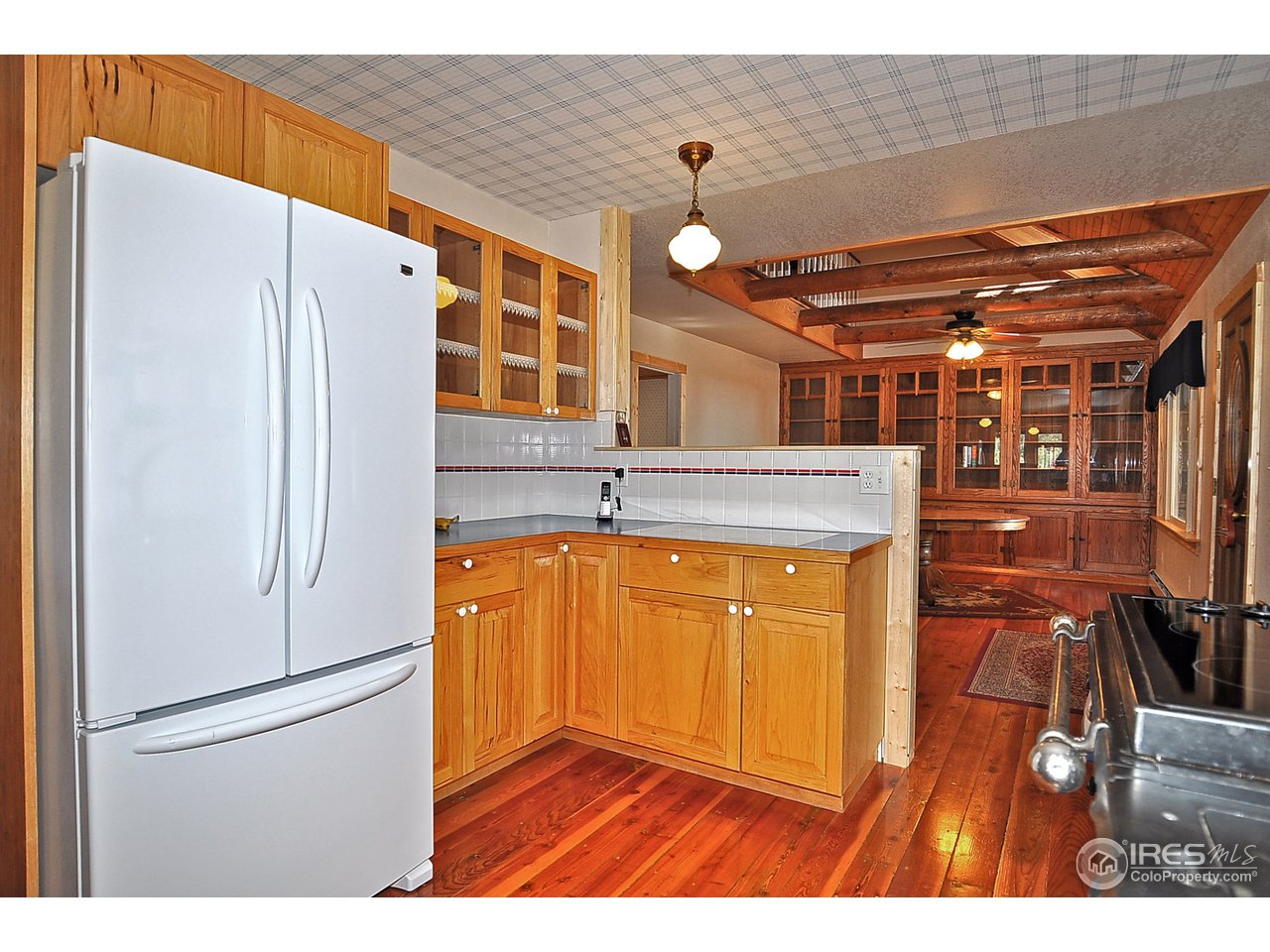 439 Redtail Ridge Way Bellvue, CO 80512 - Photo 9 of 25 a kitchen with stainless steel appliances granite countertop a refrigerator and a sink
