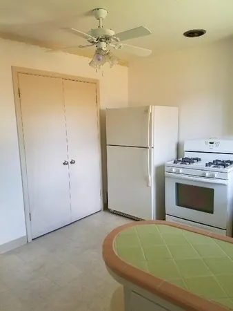 a bathroom with a tub sink and a mirror
