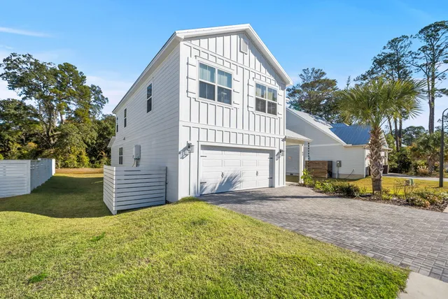 a view of an entryway with wooden floor and door
