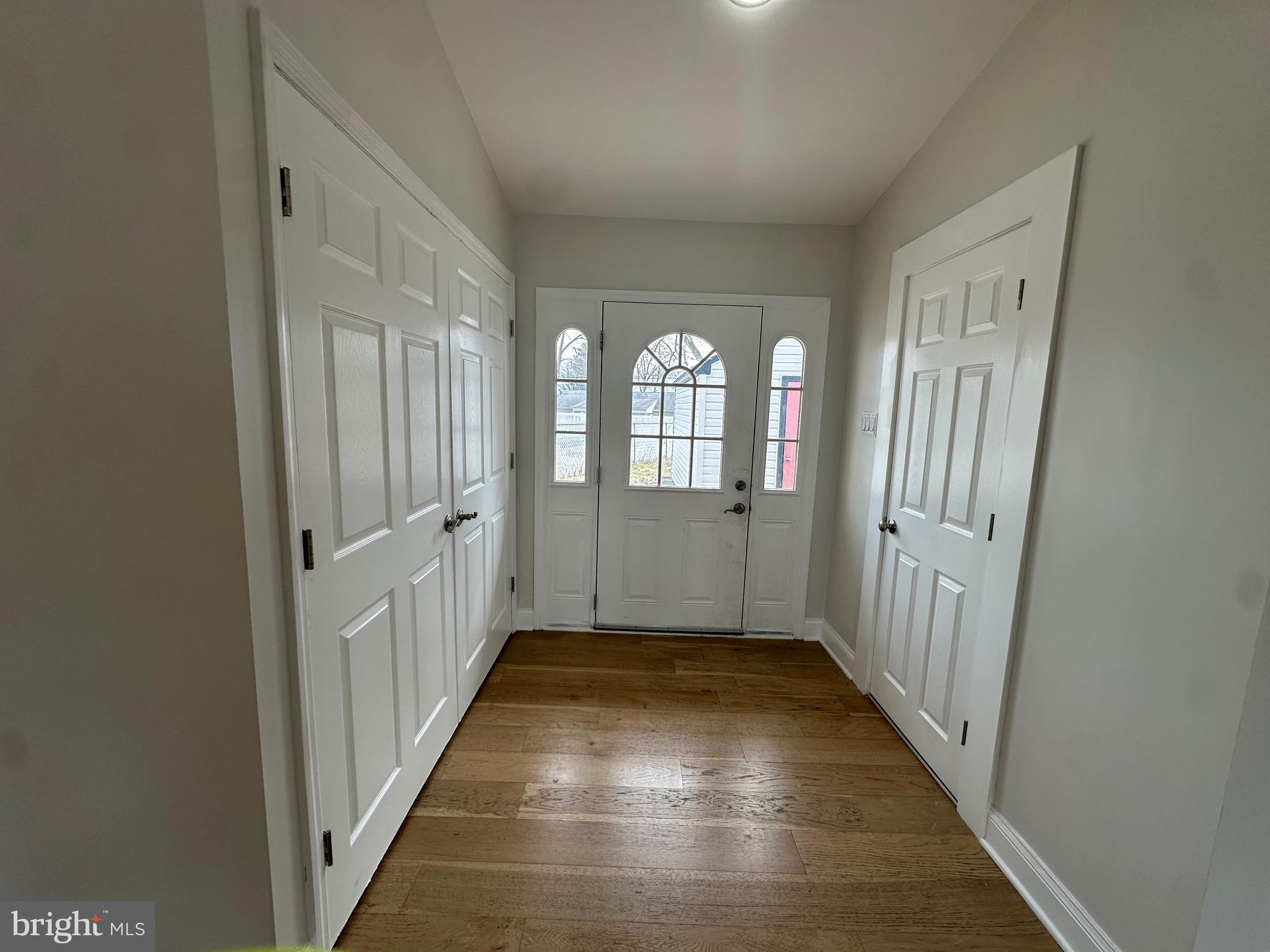 120 Lebbie Lane Fairless Hills, PA 19030 - Photo 12 of 25 a view of a hallway with wooden floor and windows