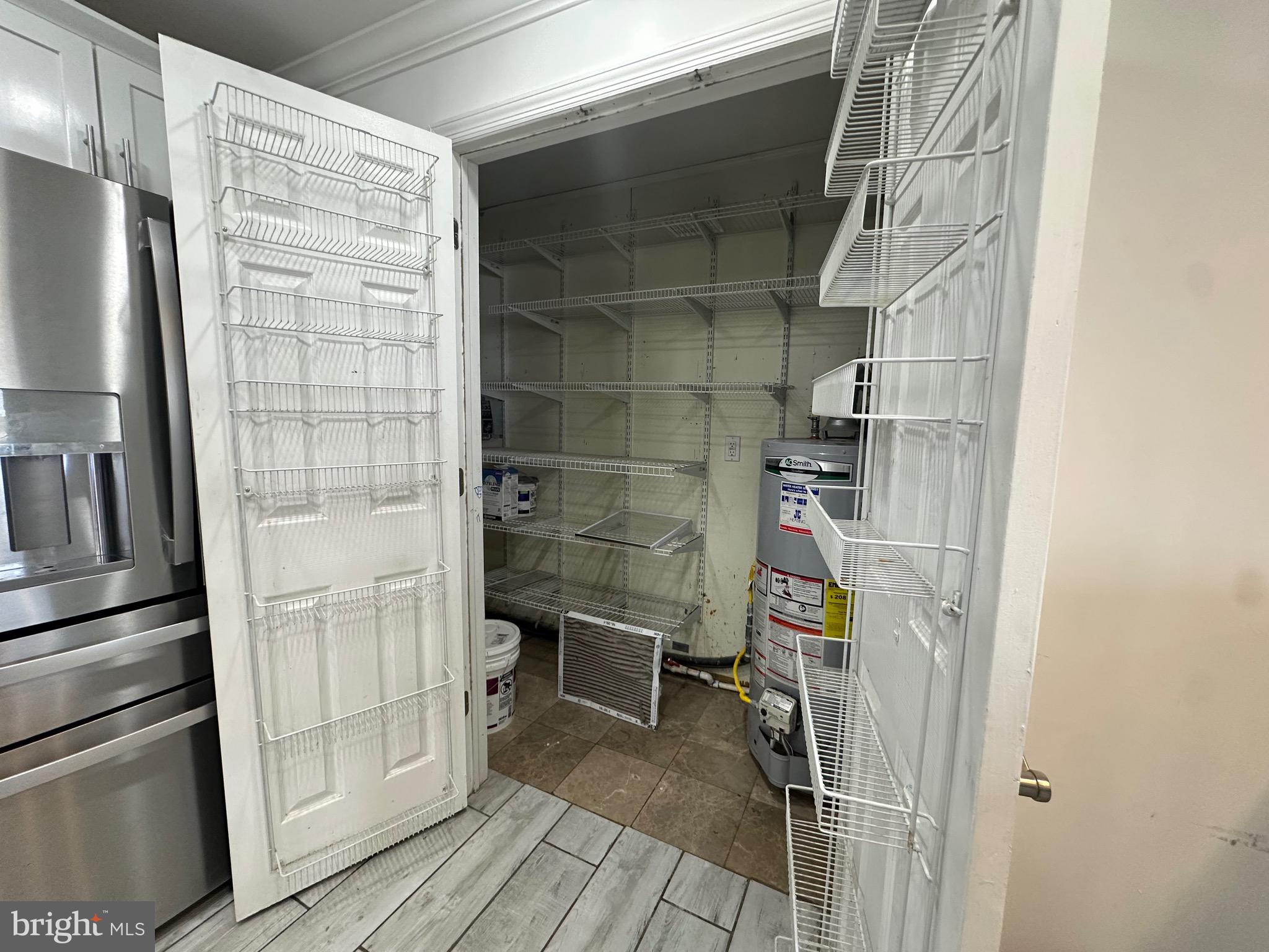 120 Lebbie Lane Fairless Hills, PA 19030 - Photo 3 of 25 a bathroom with a walk in closet and wooden floor
