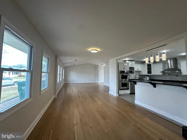 a view of a kitchen with a sink and cabinets