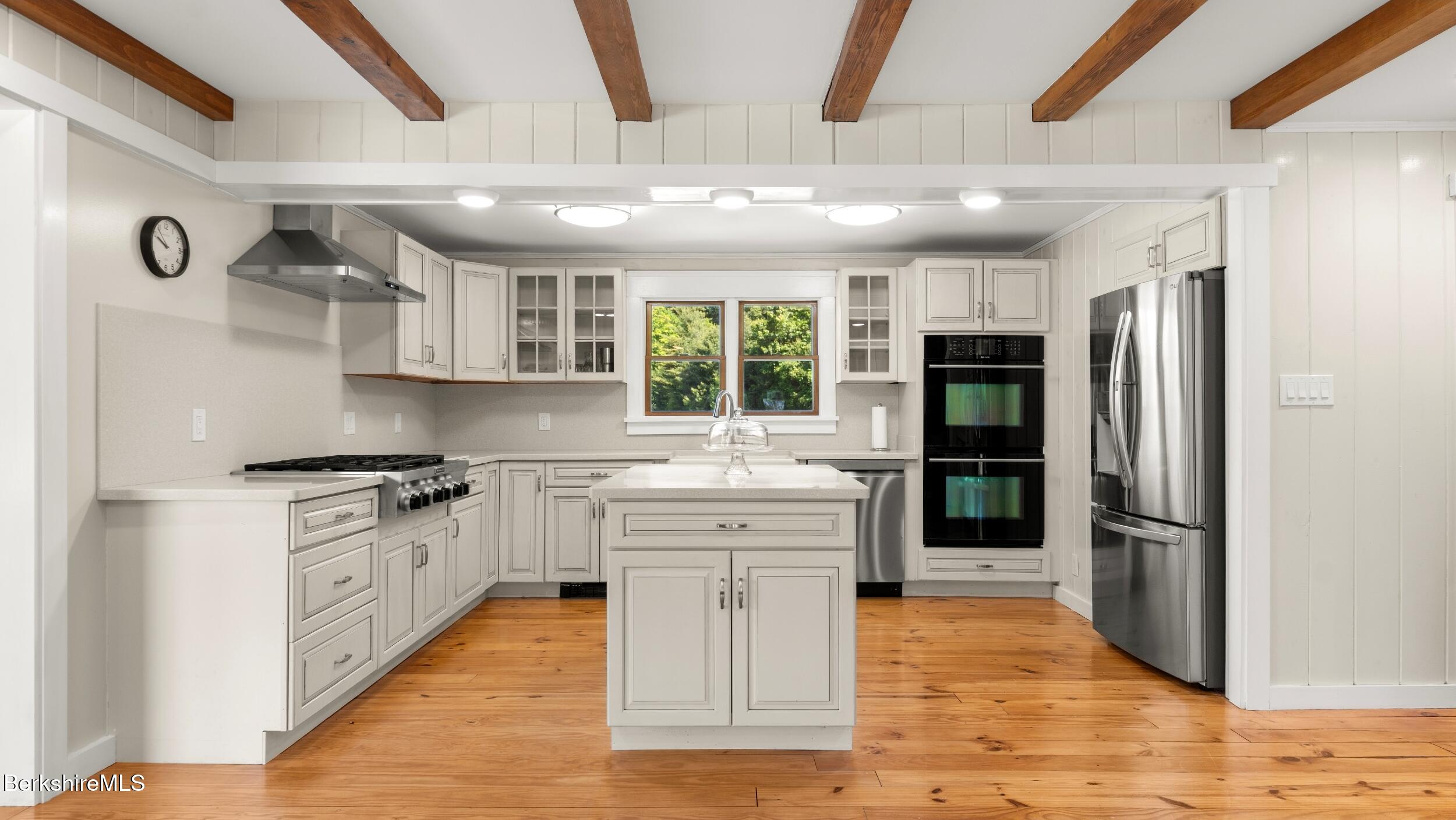 134 Hurlburt Road Great Barrington, MA 01230 - Photo 15 of 50 a large kitchen with stainless steel appliances granite countertop a large stove top oven a refrigerator and a sink