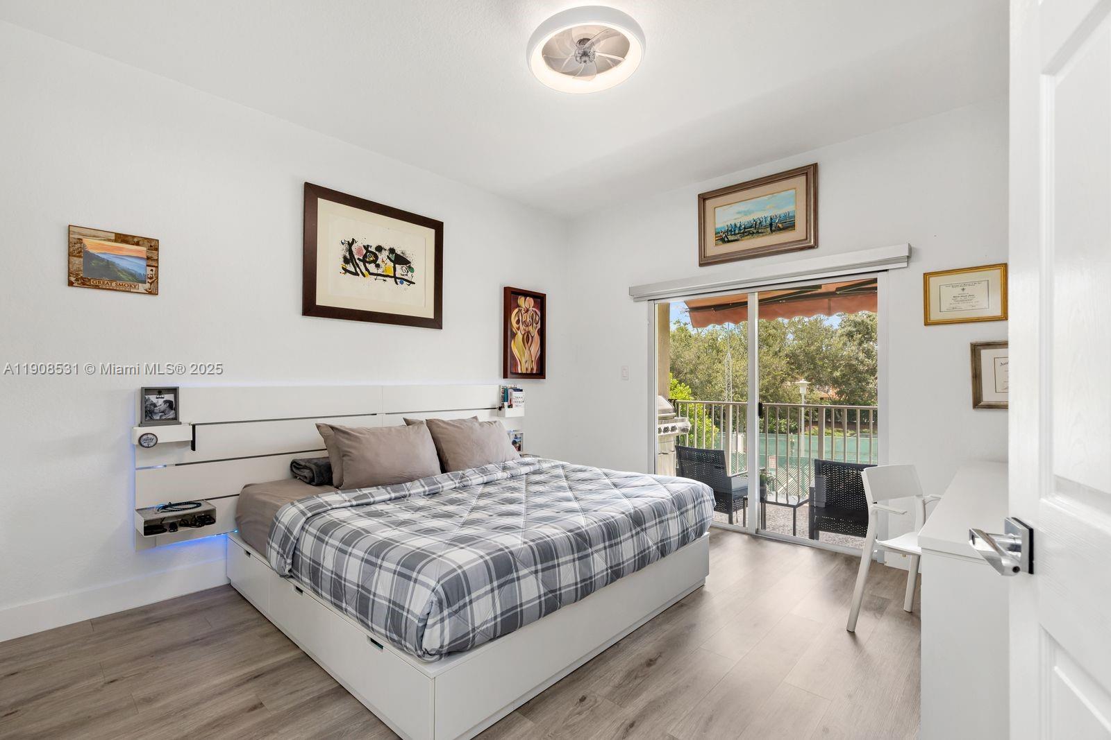 13216 Southwest 44th Street, Unit 11204 Miramar, FL 33027 - Photo 25 of 48 a bedroom with a large bed and a large window