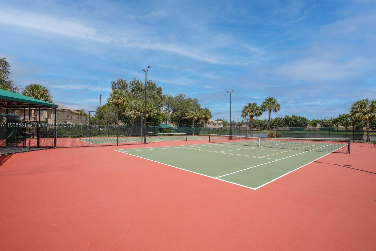13216 Southwest 44th Street, Unit 11204 Miramar, FL 33027 - Photo 3 of 48 a view of a tennis court