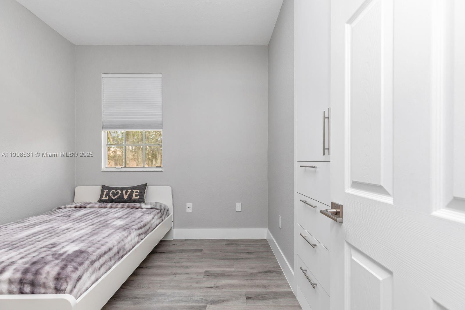 13216 Southwest 44th Street, Unit 11204 Miramar, FL 33027 - Photo 35 of 48 a bedroom with a bed and a window