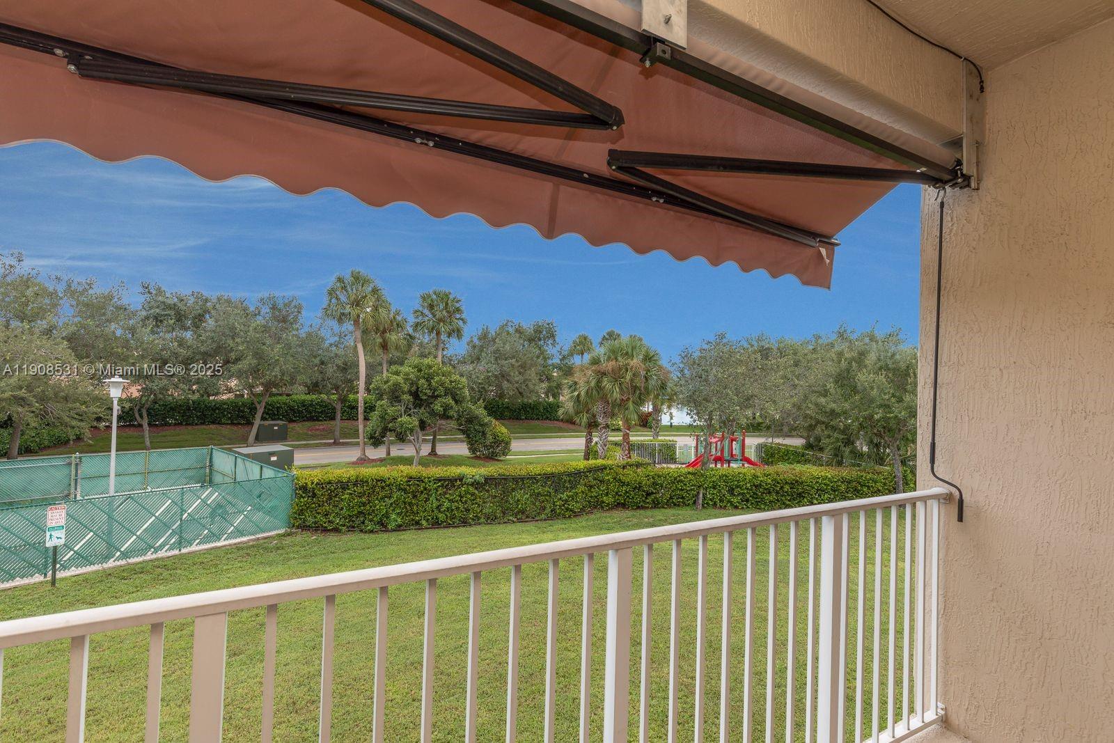 13216 Southwest 44th Street, Unit 11204 Miramar, FL 33027 - Photo 46 of 48 a view of a porch with a yard