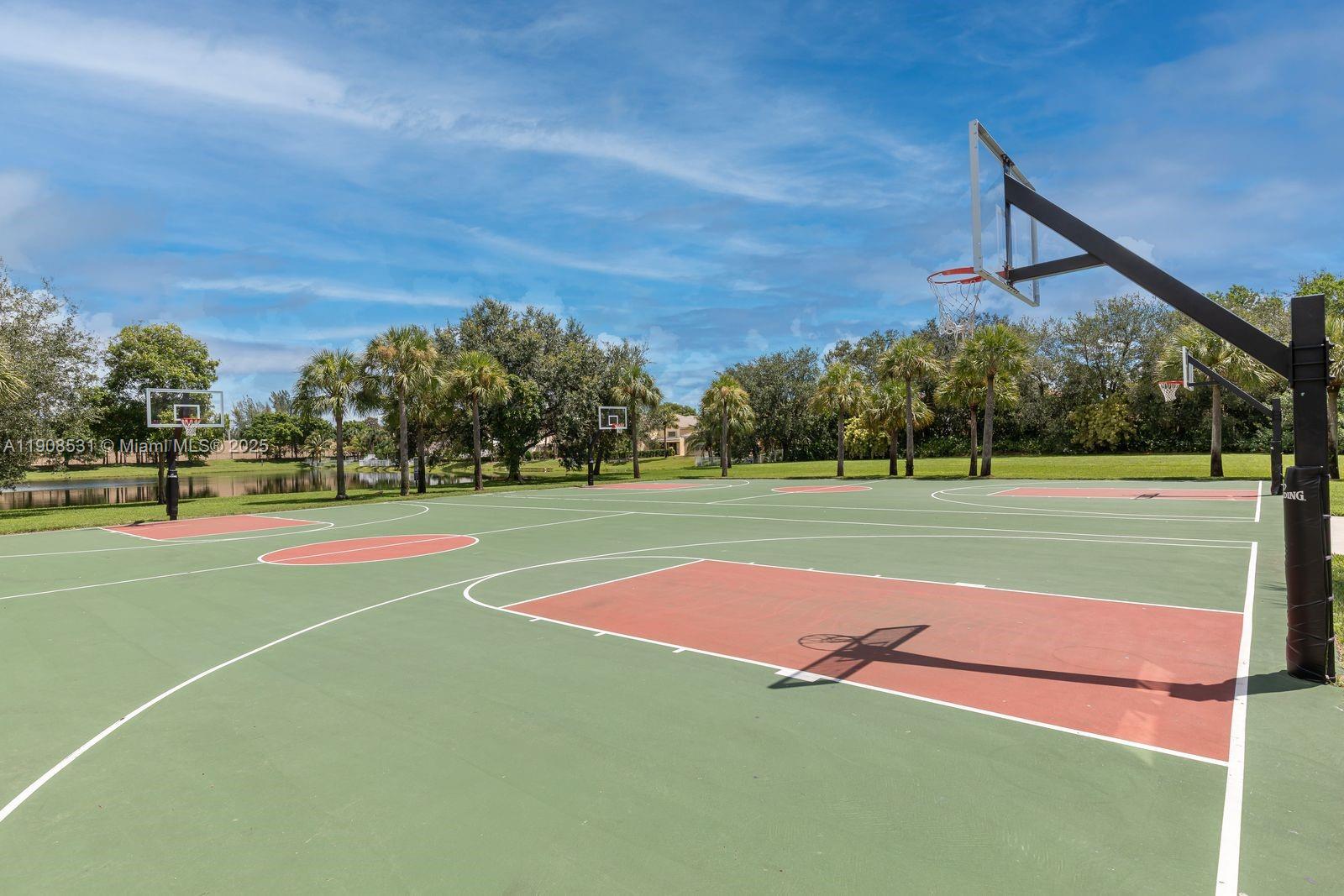 13216 Southwest 44th Street, Unit 11204 Miramar, FL 33027 - Photo 7 of 48 a view of tennis court