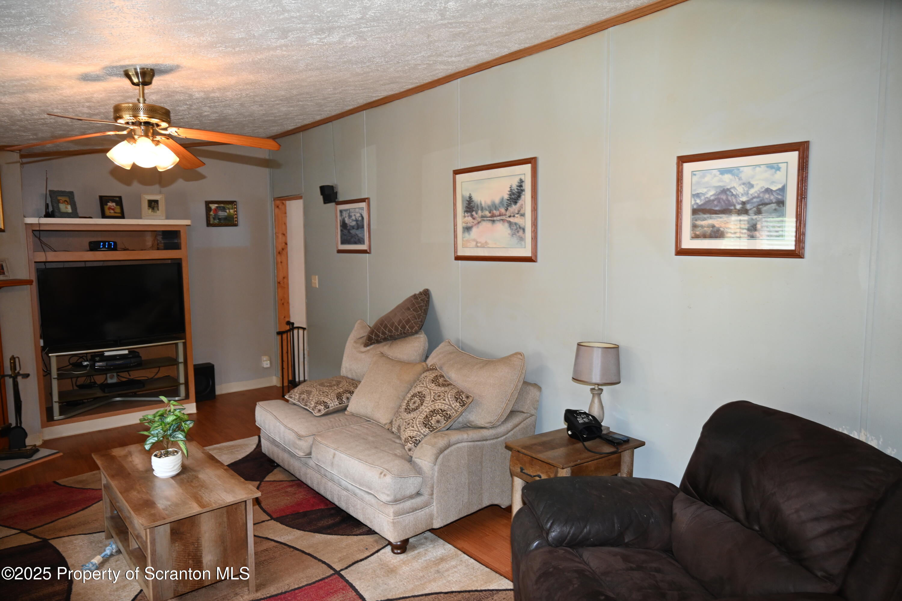 26930 Highway 11 Great Bend, PA 18821 - Photo 13 of 53 a living room with furniture a flat screen tv and a window