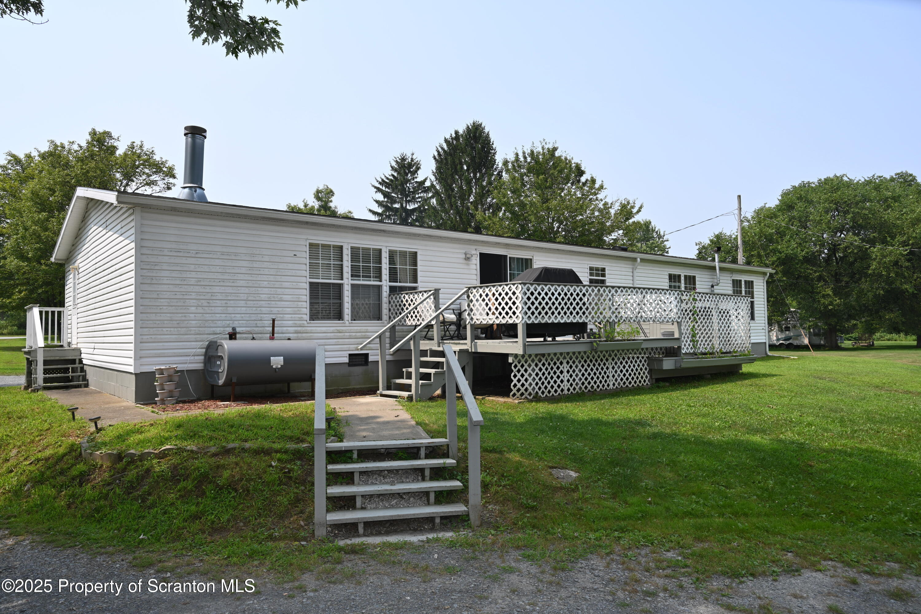26930 Highway 11 Great Bend, PA 18821 - Photo 29 of 53 a view of a house with backyard and a garden