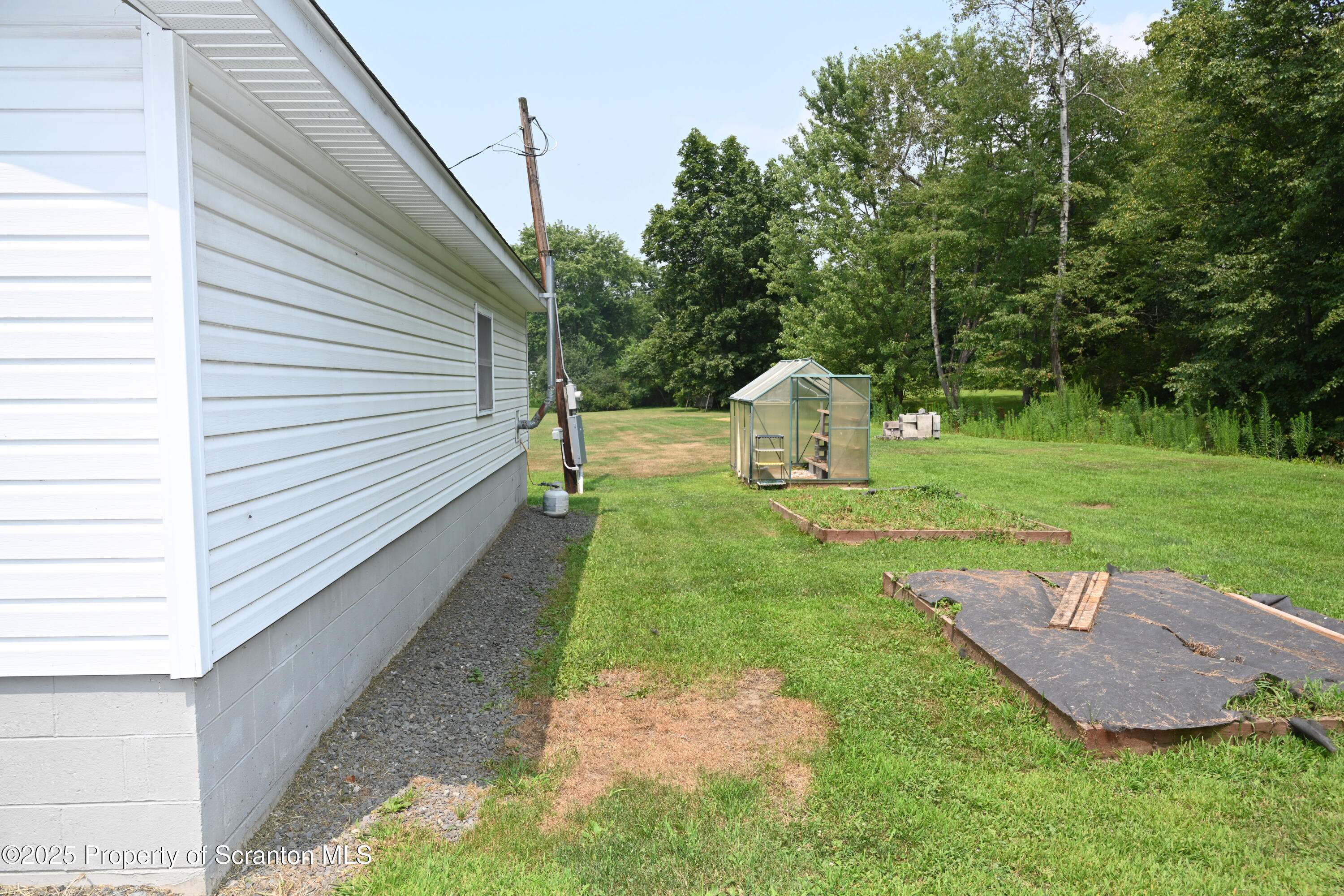 26930 Highway 11 Great Bend, PA 18821 - Photo 33 of 53 a view of a backyard with sitting area