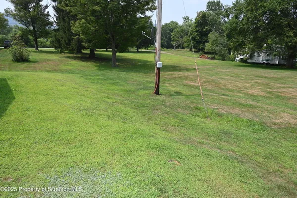 a view of a house with a big yard