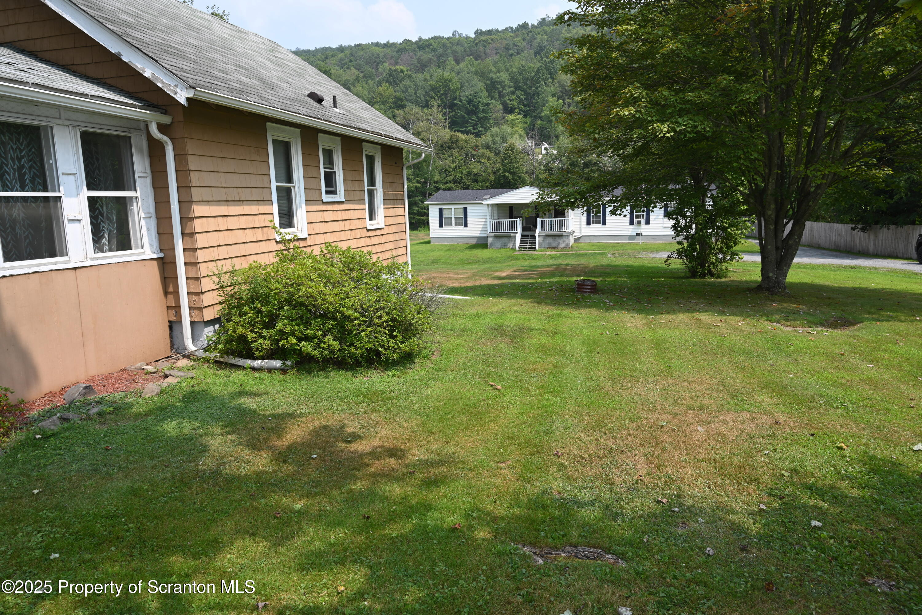 26930 Highway 11 Great Bend, PA 18821 - Photo 45 of 53 a front view of a house with garden