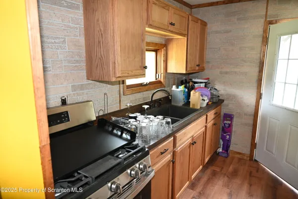 a view of a door with furniture and a window
