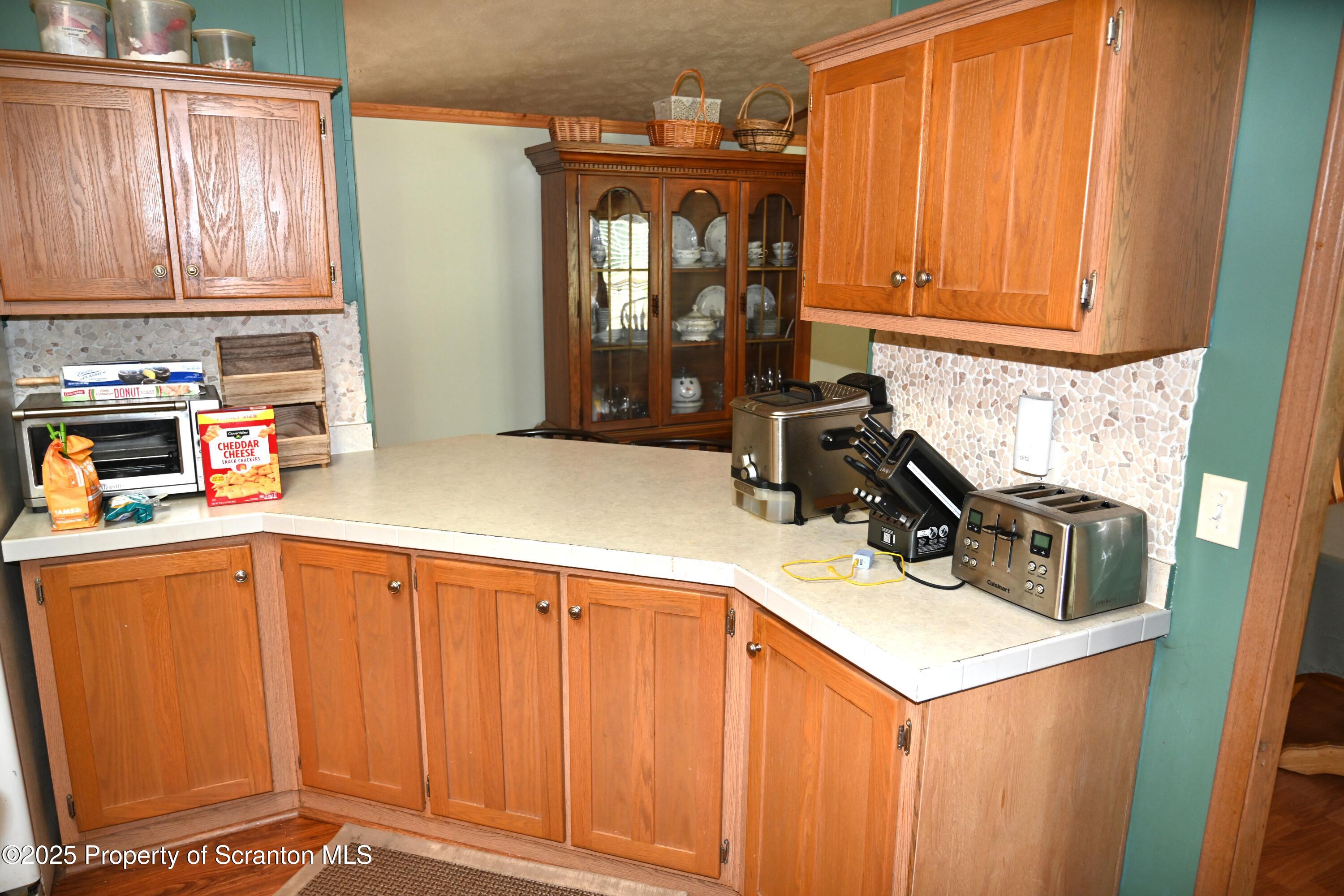 26930 Highway 11 Great Bend, PA 18821 - Photo 5 of 53 a kitchen with a sink cabinets and window