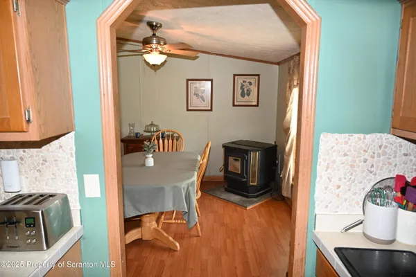 a view of a dining room with furniture wooden floor and chandelier