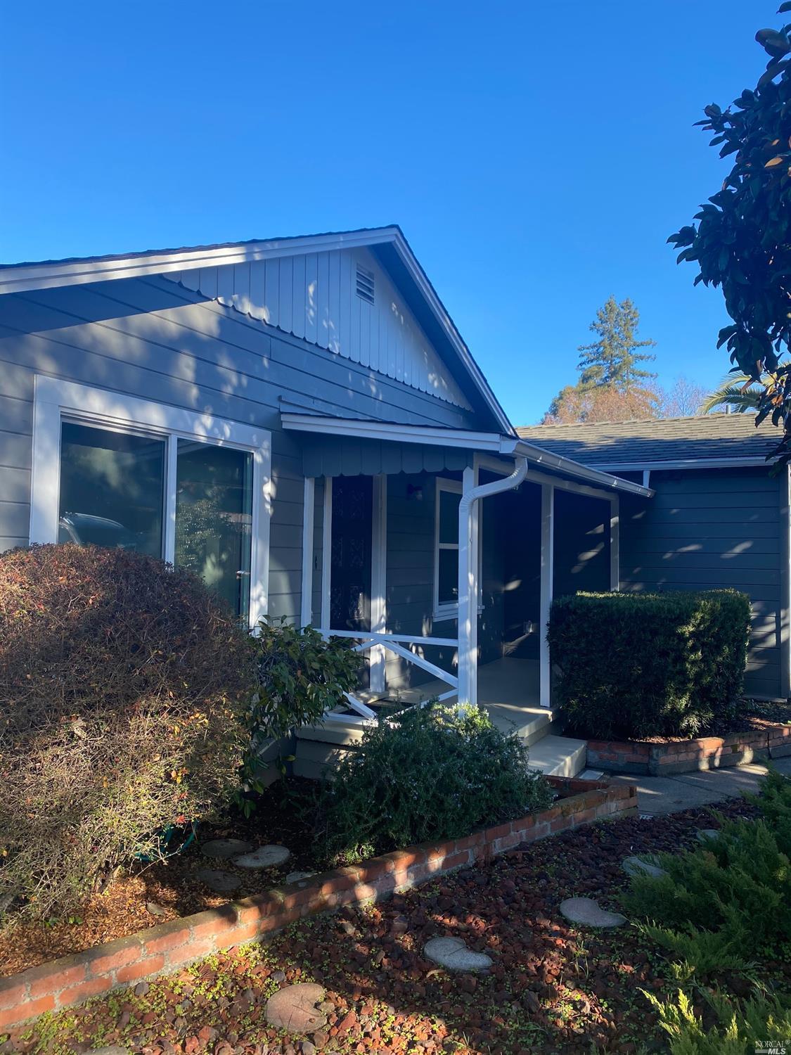 a front view of a house with garden