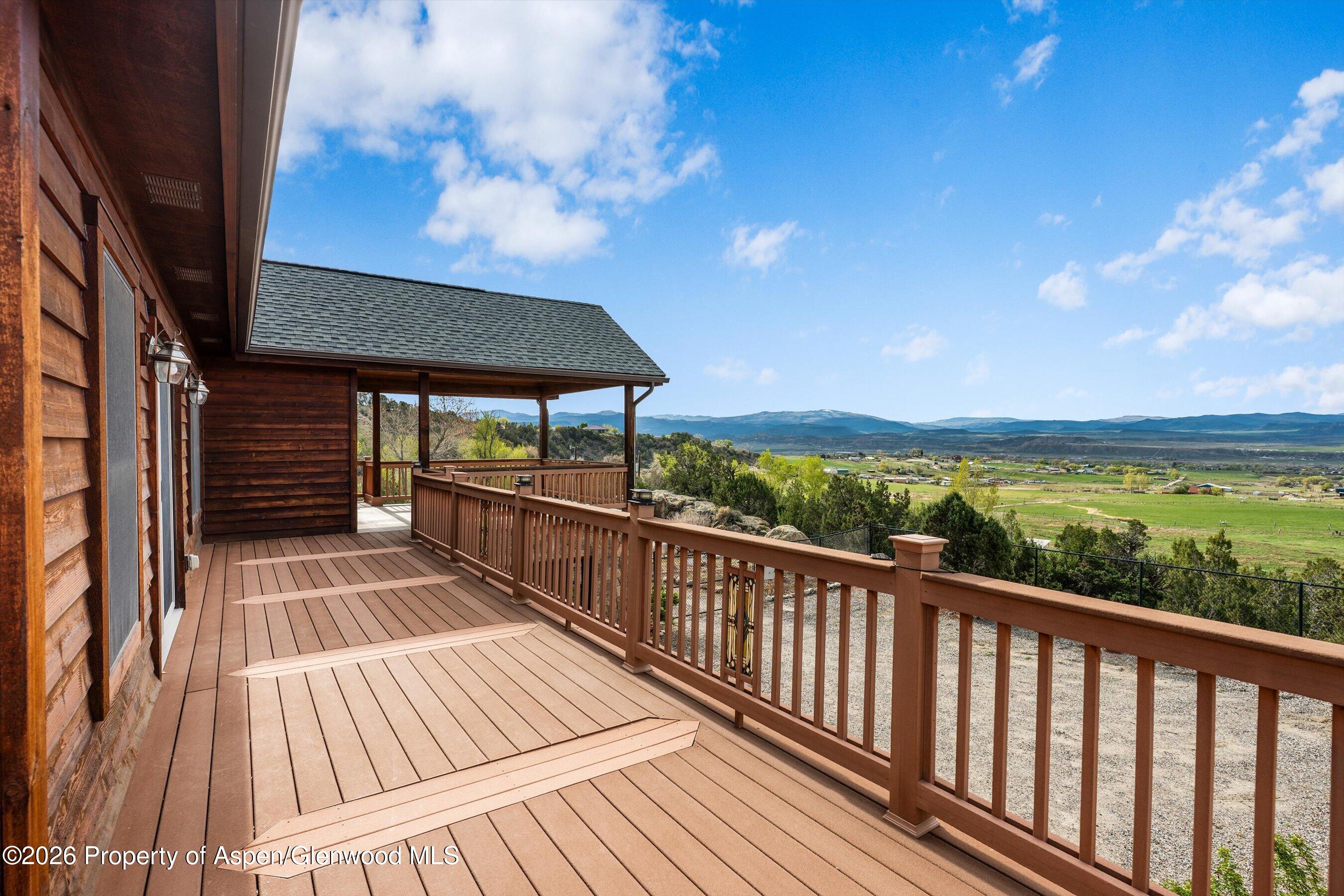 450 Summer Falls Road Silt, CO 81652 - Photo 34 of 50 a view of balcony with wooden floor and outdoor seating