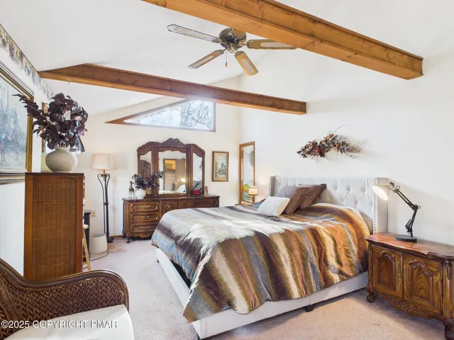 a bedroom with bed and window