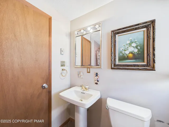 a picture of a bench in a white wall