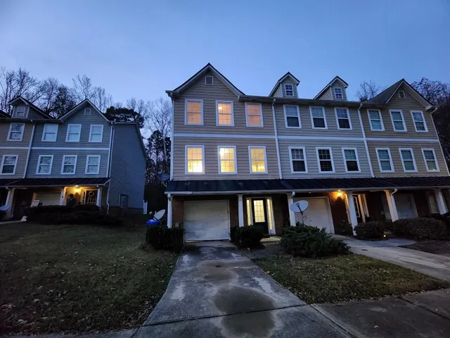 a front view of a building with a yard