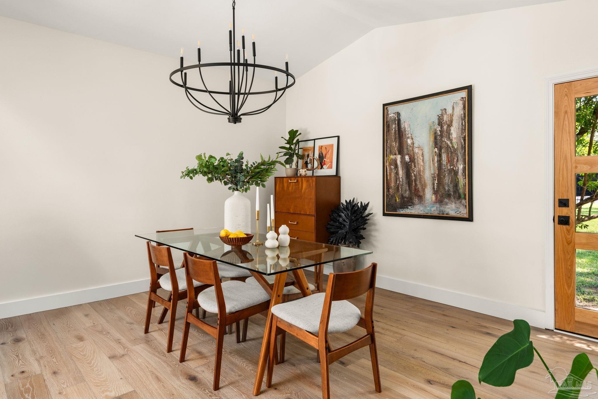 7716 Sunshine Hill Road Molino, FL 32577 - Photo 12 of 37 a view of a dining room with furniture and wooden floor