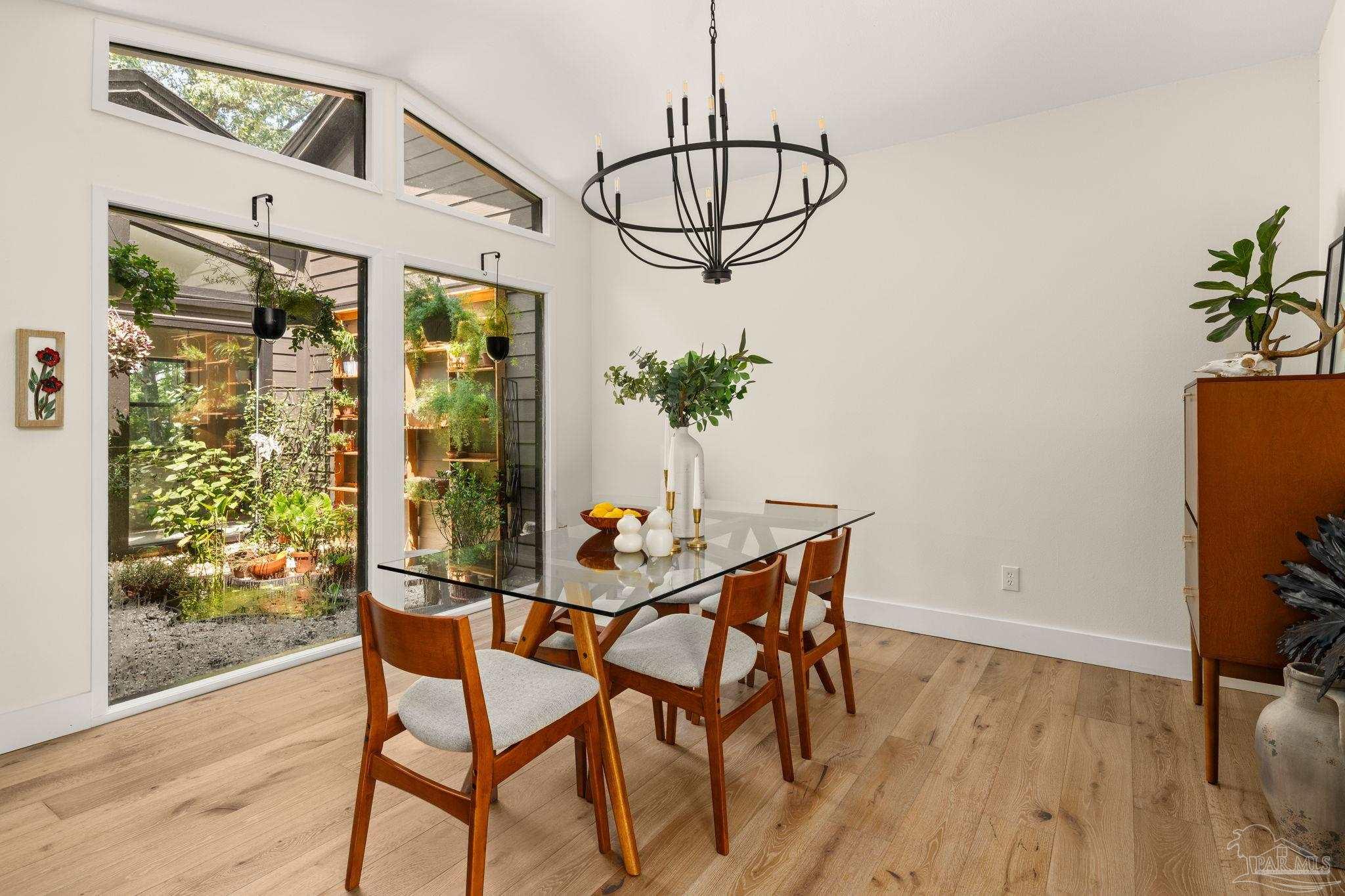 7716 Sunshine Hill Road Molino, FL 32577 - Photo 13 of 37 a view of a dining room with furniture window and wooden floor