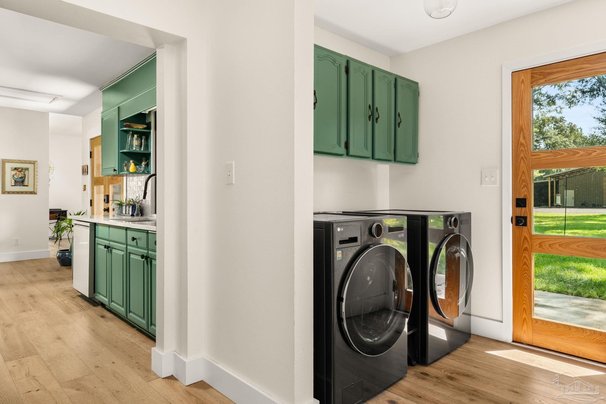 7716 Sunshine Hill Road Molino, FL 32577 - Photo 14 of 37 a utility room with dryer and washer