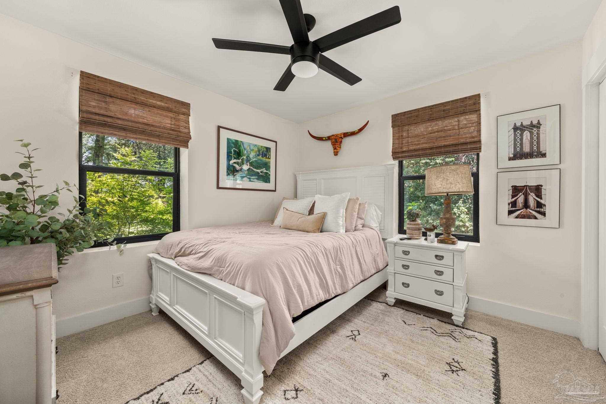 7716 Sunshine Hill Road Molino, FL 32577 - Photo 15 of 37 a bed room with a bed and a window