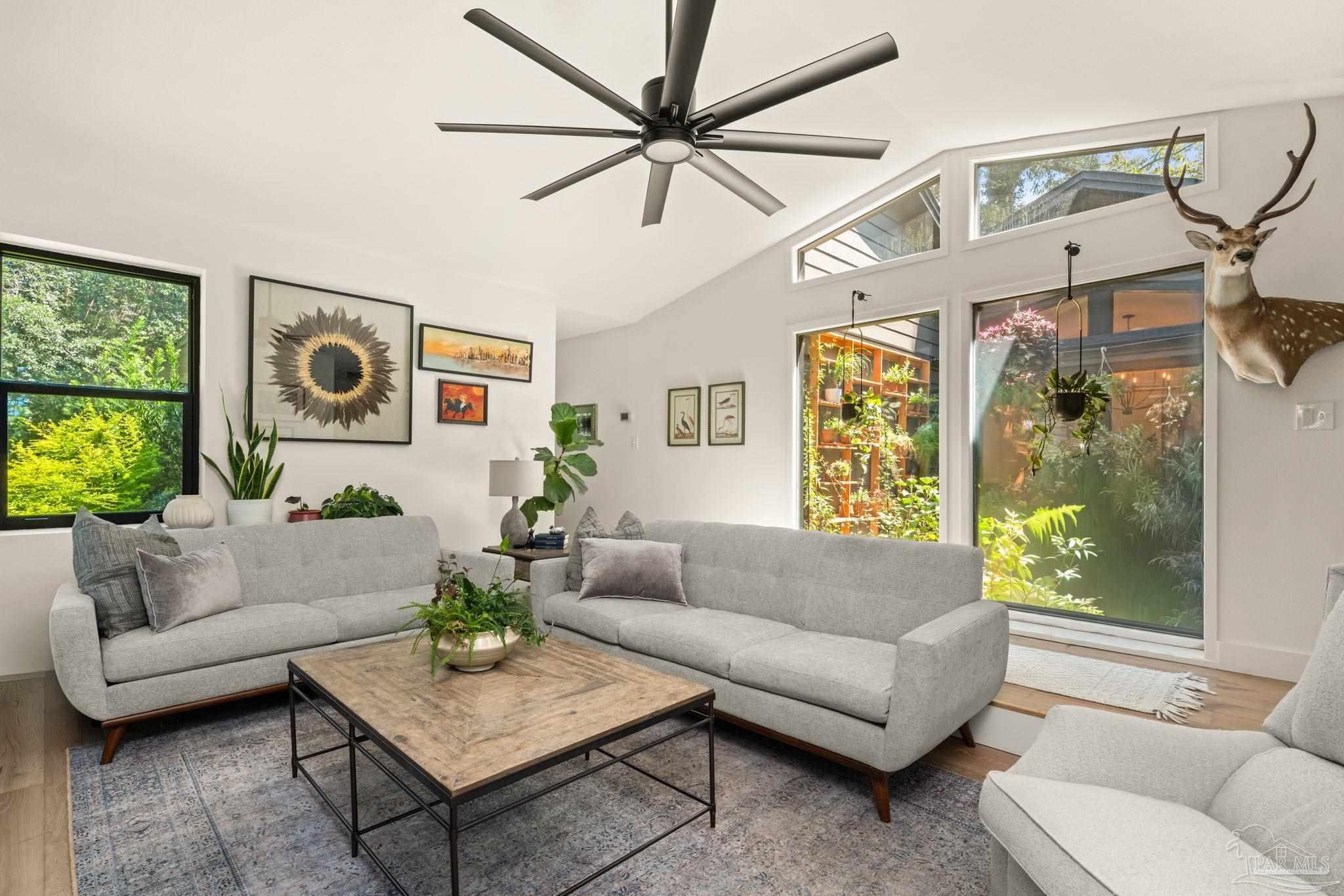 7716 Sunshine Hill Road Molino, FL 32577 - Photo 25 of 37 a living room with furniture and a large window