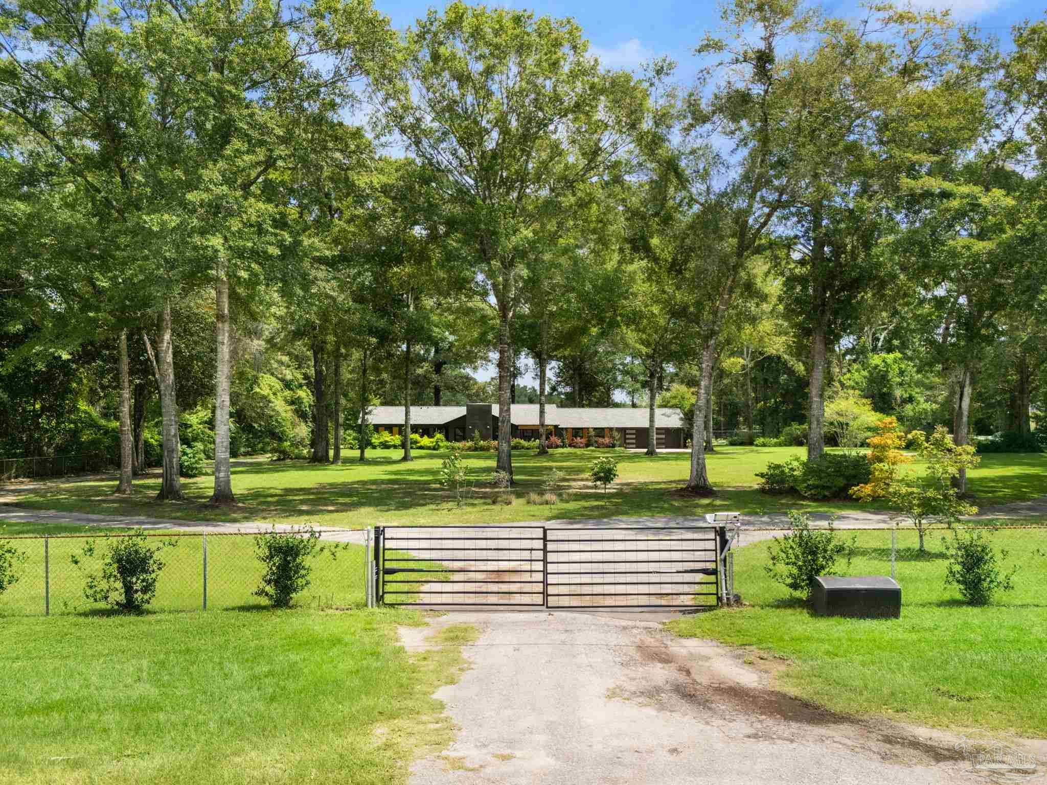 7716 Sunshine Hill Road Molino, FL 32577 - Photo 31 of 37 a view of a park with plants and trees