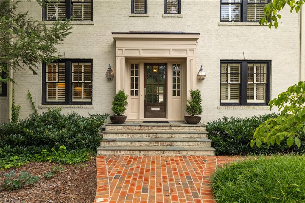 2105 Rolling Road Greensboro, NC 27403 - Photo 4 of 50 Classic brick paver walkway that leads to the handsome slate steps