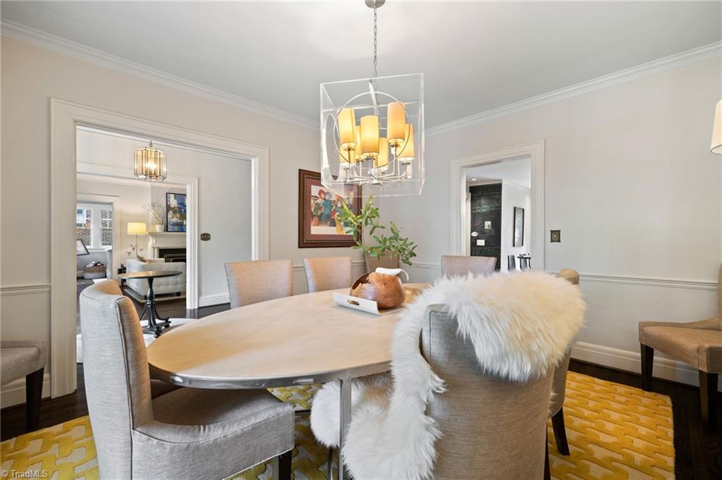 2105 Rolling Road Greensboro, NC 27403 - Photo 7 of 50 Notice the dramatic contemporary chandelier in the dining room