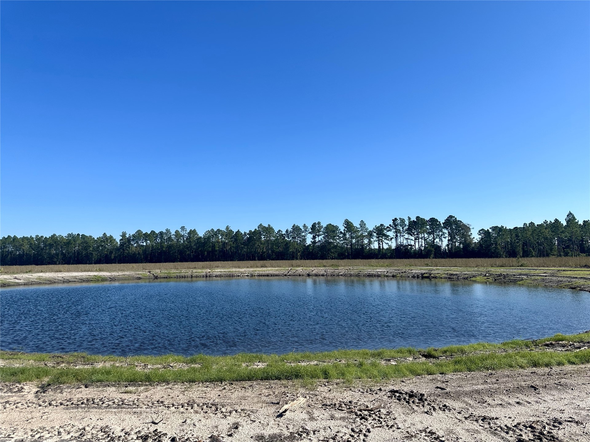 Lot 15 Andrews Road Hilliard, FL 32046 - Photo 9 of 24 a view of a lake with houses in the back