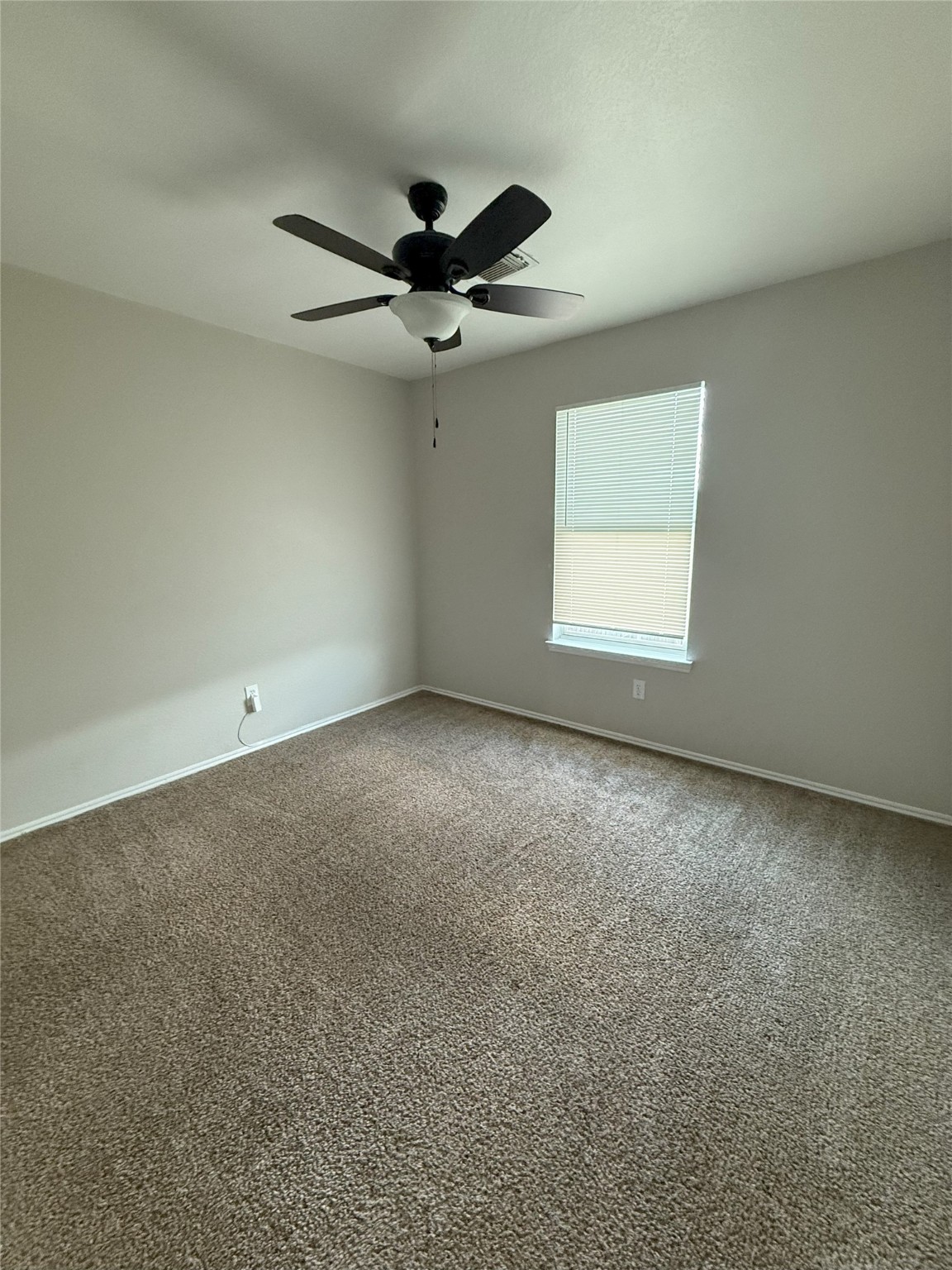 22819 Sugar Bear Drive Spring, TX 77389 - Photo 18 of 20 an empty room with a window and a fan