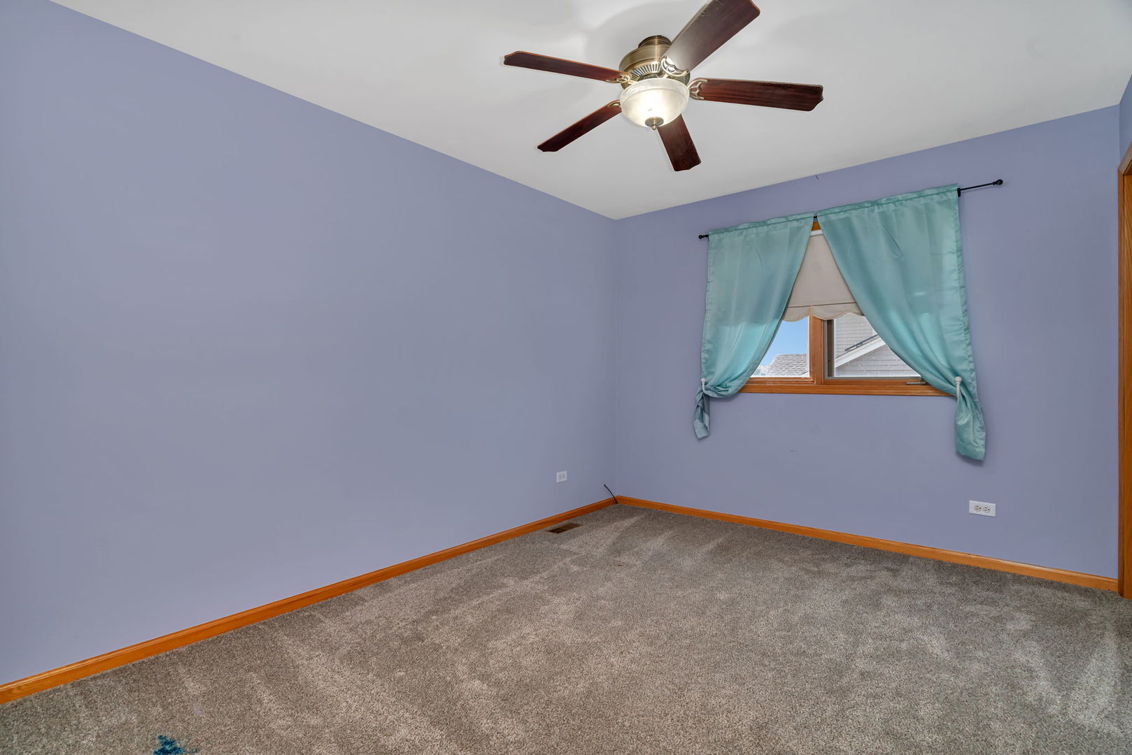 605 High Grove Drive Minooka, IL 60447 - Photo 25 of 42 an empty room with ceiling fan and window