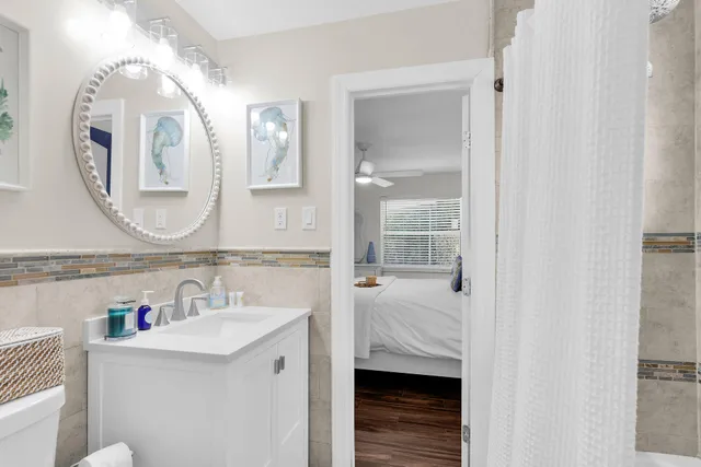 a bedroom with a bed and a television