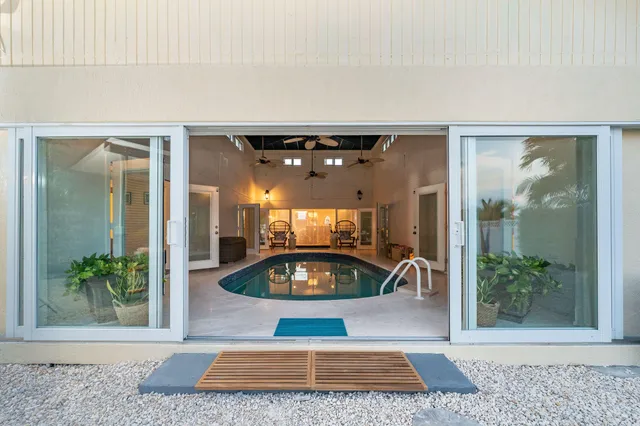 an aerial view of a city with lots of residential buildings lake and ocean view