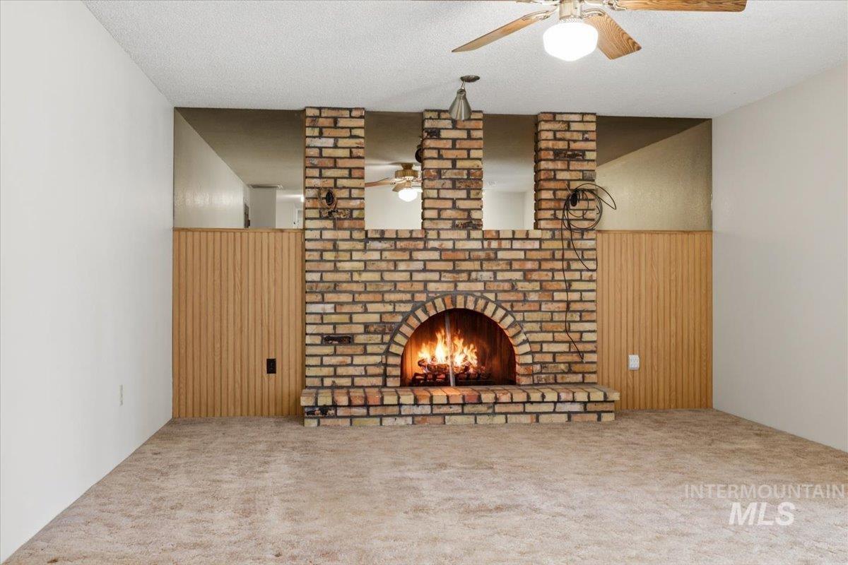 1311 North Middleton Road Nampa, ID 83651 - Photo 40 of 49 Brick fireplace with an arched firebox, hearth, and decorative brickwork