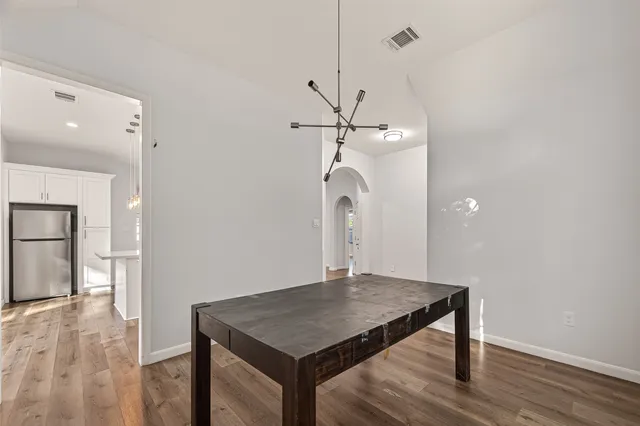 a view of a room with wooden floor and staircase
