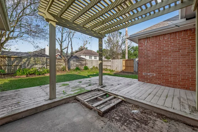 a view of a backyard with wooden floor