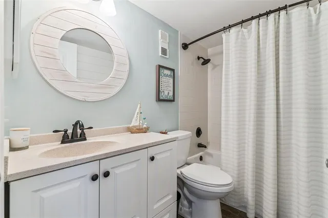 a living room with baby crib and furniture