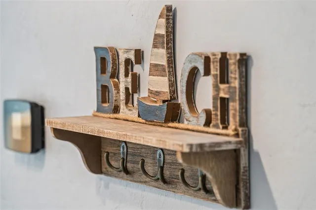 a bedroom with two beds and a chandelier