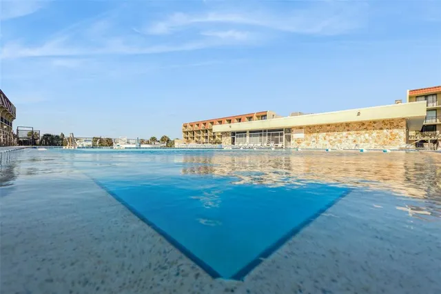 a room with lots of furniture and white walls