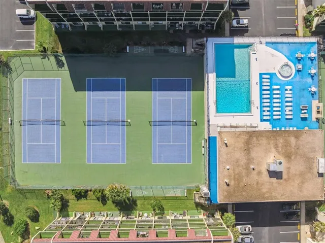 an aerial view of residential building and ocean view