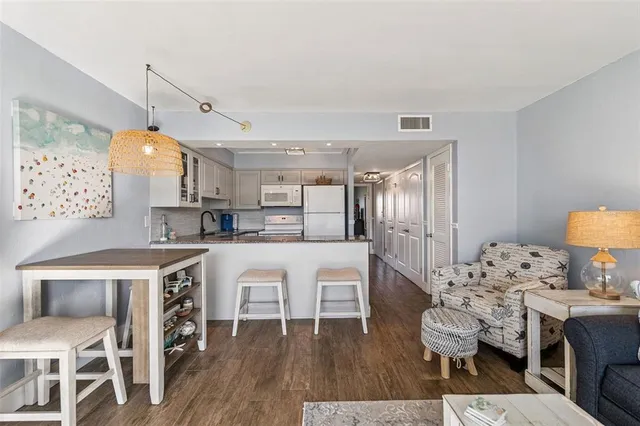 a view of kitchen with cabinets and wooden floor